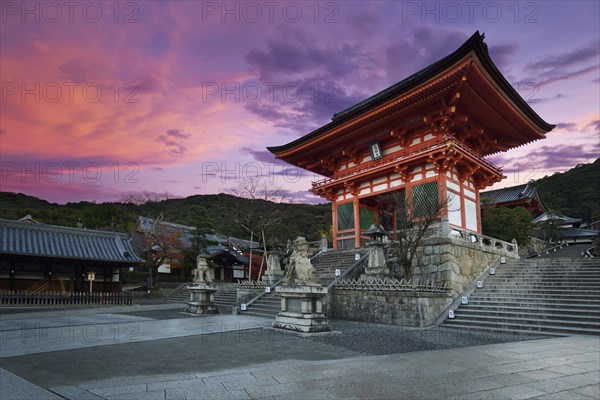 Nio-mon gate of Kiyomizu-dera Buddhist temple in beautiful sunrise morning scenery with dramatic red sky