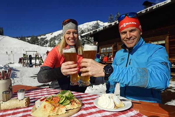 Olympic silver medal winner Tobi Angerer with his wife Romy at the snack on the Wildalm