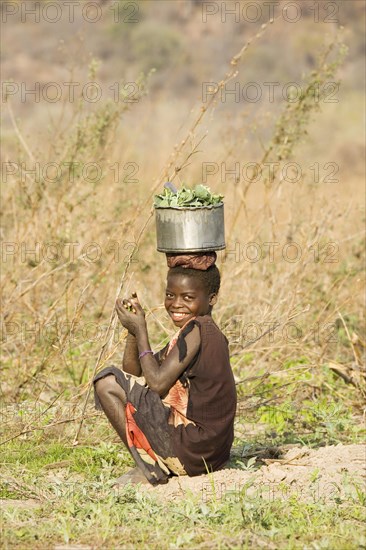 Tonga girl with vegetables