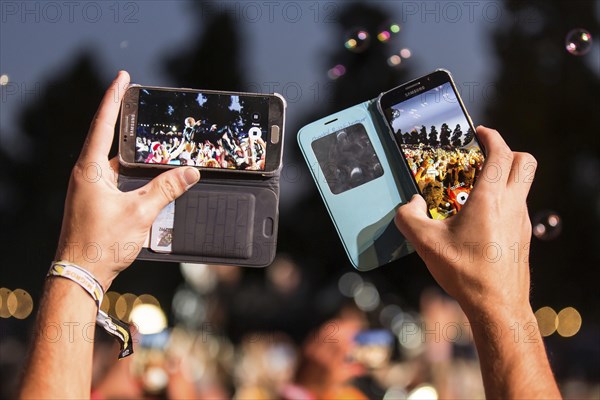 Festival visitor takes photos with Iphone from the British band Skunk Anansie and singer Deborah Anne Dyer alias Skin live at the 26th Heitere Open Air in Zofingen