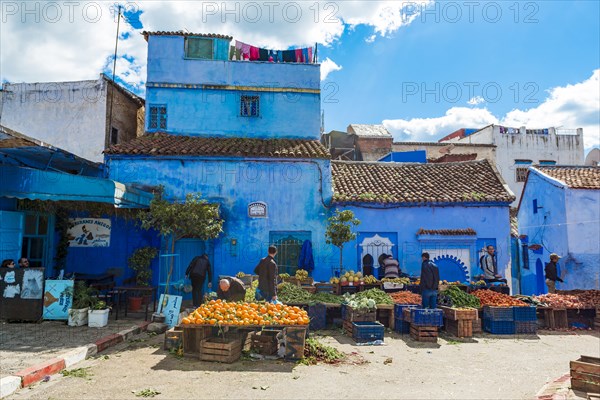 Locals buying vegetables and fruits