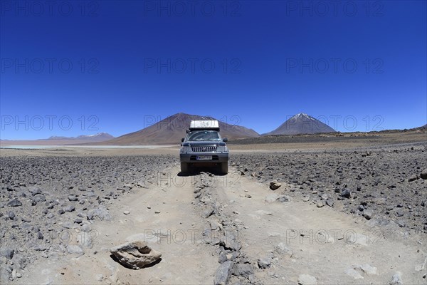 Off-road vehicle on the way on the lagoon route in the Altiplano