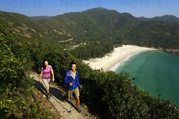 Hikers on the McLehose Trail overlooking Long Ke Beach