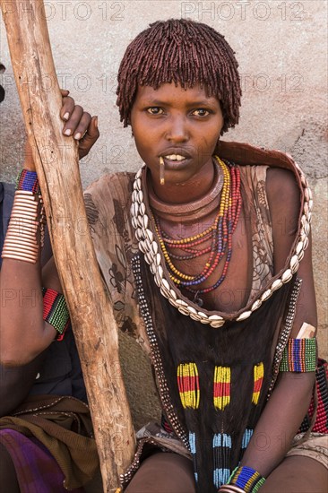 Young woman with traditional clothes from the Hamer tribe