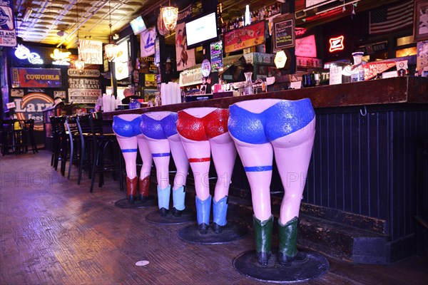 Barstool in the form of a can-can dancer in the Longhorn Saloon