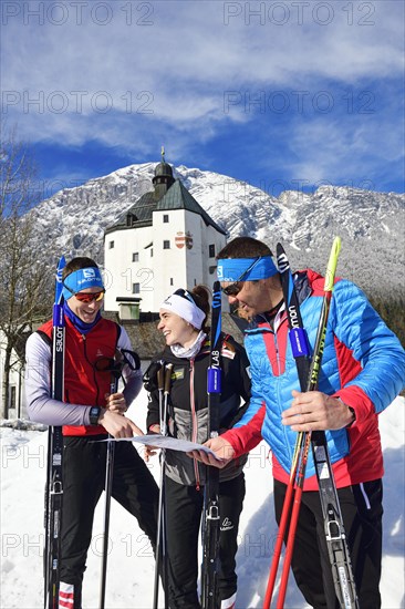 Cross-country skiers in front of the Mariastein pilgrimage church