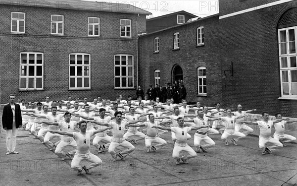 Group of men in the yard during their morning sports