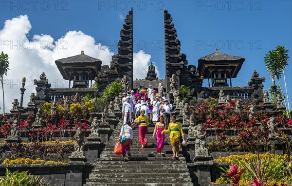 Devout Balinese descend stairs