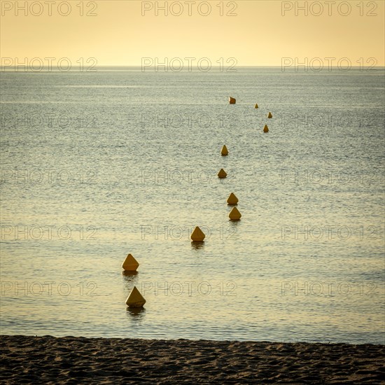 Yellow buoys in water