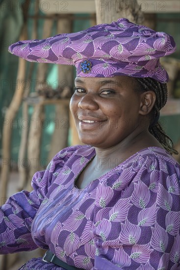 Native Herero woman with typical headgear and clothes