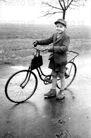 Boy with bicycle
