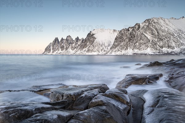 Icy coastal landscape on dusk