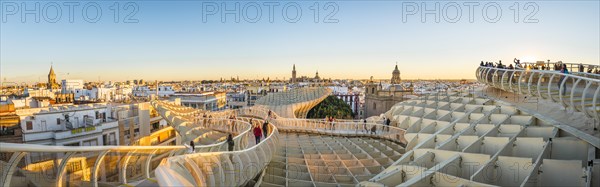 View from Metropol Parasol to numerous churches at sunset