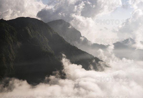 Mountain slopes above the sea of clouds