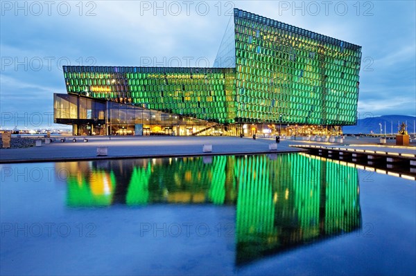 Illuminated Harpa Concert Hall at dusk