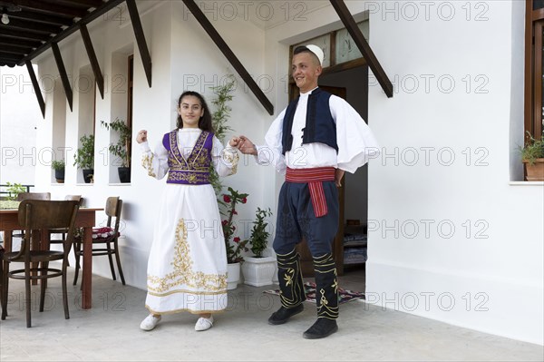 Local folkloric group in traditional costume demonstrating national Albanian dance