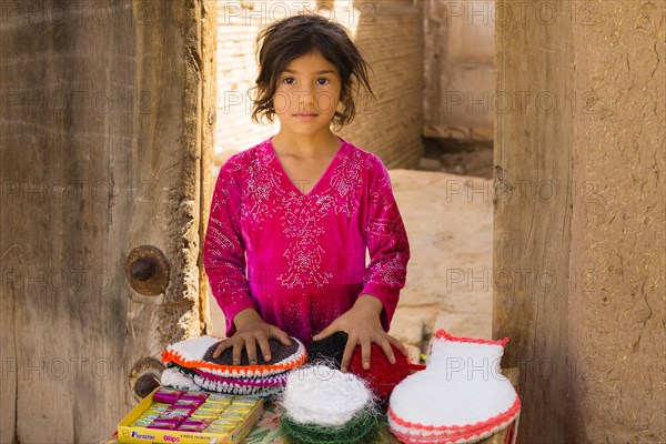 Young girl sells goods in the streets of Yazd