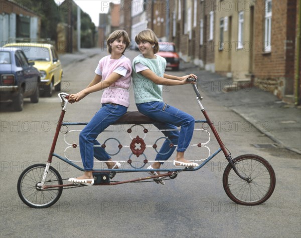 Two girls driving tandem