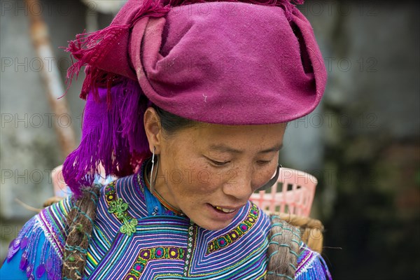 Woman in traditional dress of the Flower Hmong