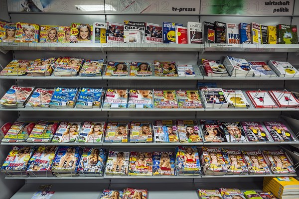 Shelf with magazines in a supermarket