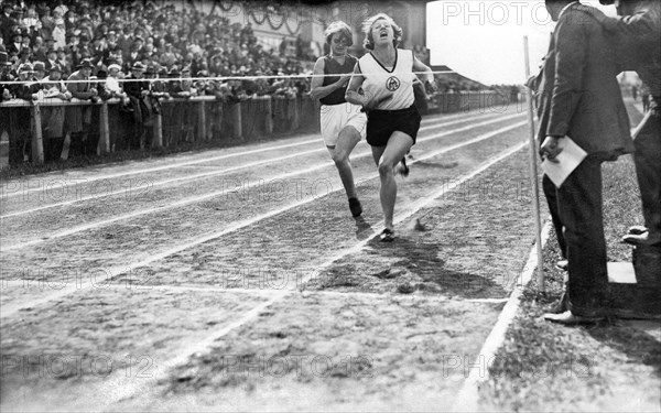 Two female runners at the finish line