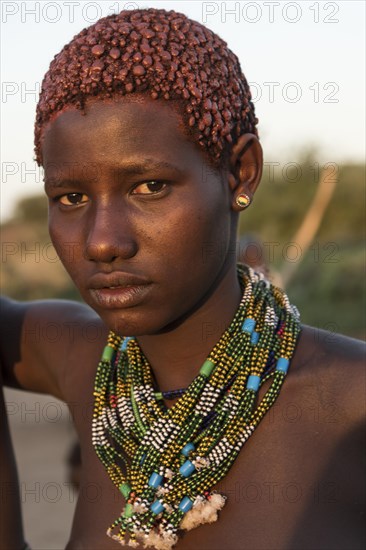 Girl with necklace approx. 16 years