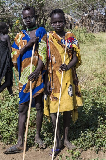 Two boys with sticks