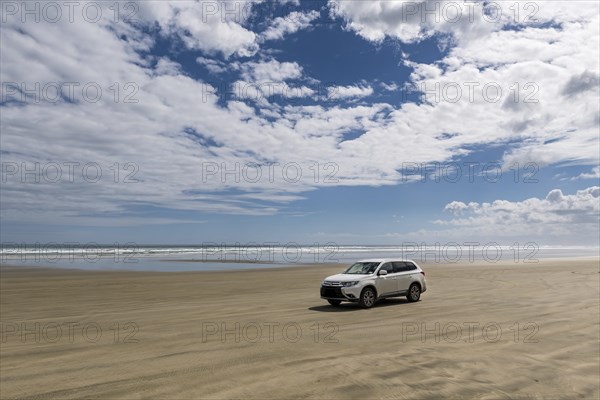 4x4 car at the wide sand beach