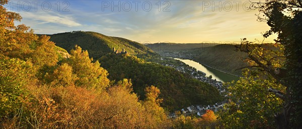 View into the Moselle valley in autumn with Thurant Castle over the wine village of Alken