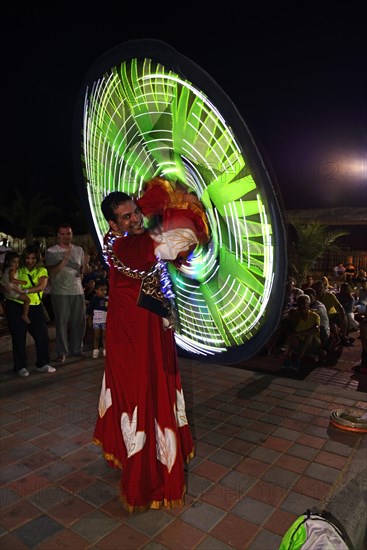 Bedouin turns luminous cape in Bedouin Oasis Desert Experience