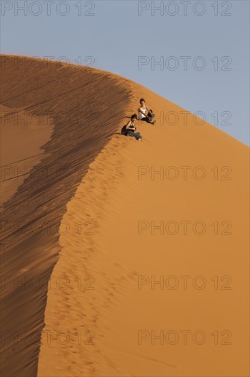 Tourists having fun at Dune 45 in the Namib Desert