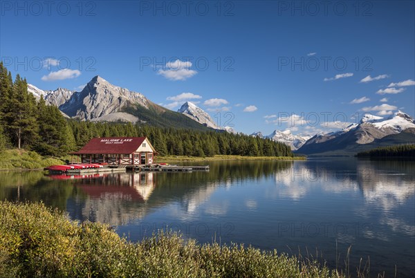 Boathouse with canoes on the shores of Maligne Lake