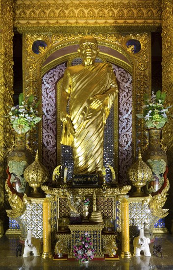 Golden Monk at Phra Maha Chedi Chai Mongkhon Pagoda