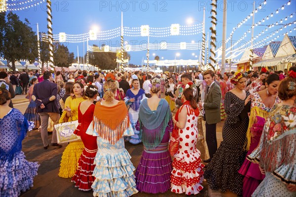 Spanish women with colorful flamenco dresses