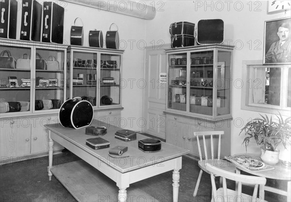 Suitcase in the salesroom with Hitler portrait on the wall