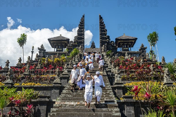 Devout Balinese descend stairs