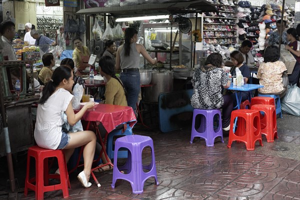 Streetfood stand with colourful tables and chairs