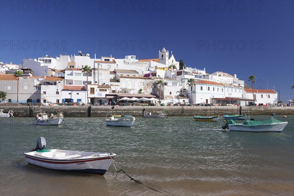 Boats in front of the fishing village of Ferragudo