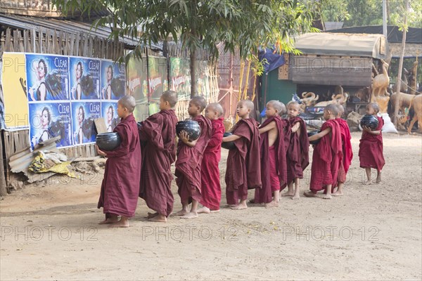 Young monks on their morning traditionell alms rounds