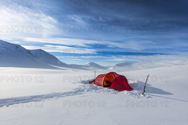 Tent with person in the snow