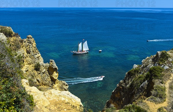Sailboat and motorboats off Camilo Beach