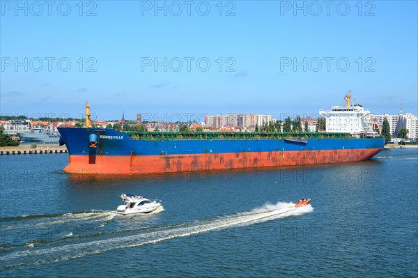 Freighter and boats on River Swina at Swinoujscie