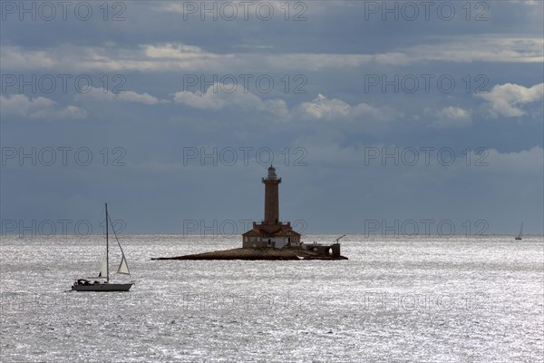 Lighthouse with sailboat