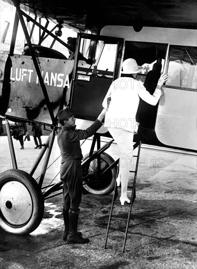 Woman boarding a Lufthansa passenger plane