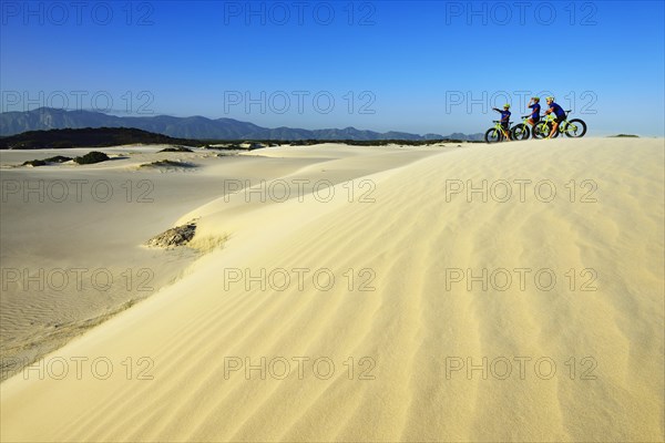 Mountain biking with fat bikes on sand dunes