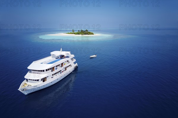 Diving safari ship MS Keana off an uninhabited palm island