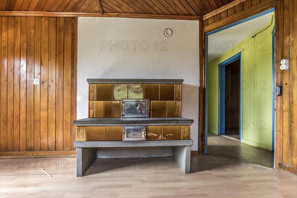 Tiled stove in an empty house