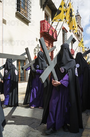 Penitents with cross at the Semana Santa