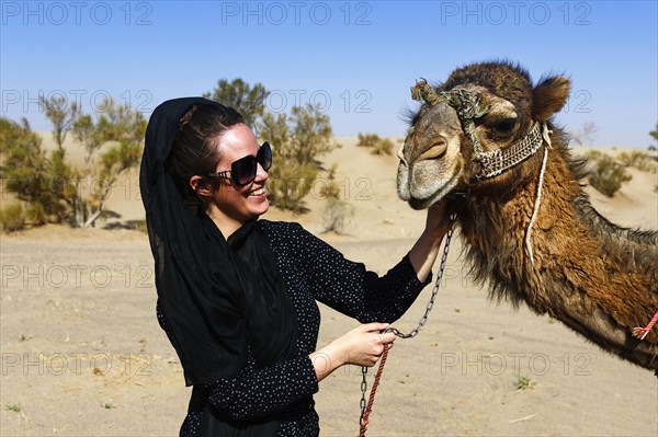 Tourist with camel on camel tour