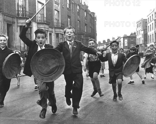 Children with shield and stick play knights